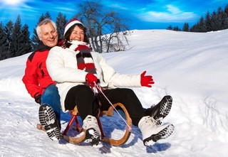 Older Couple Sledding